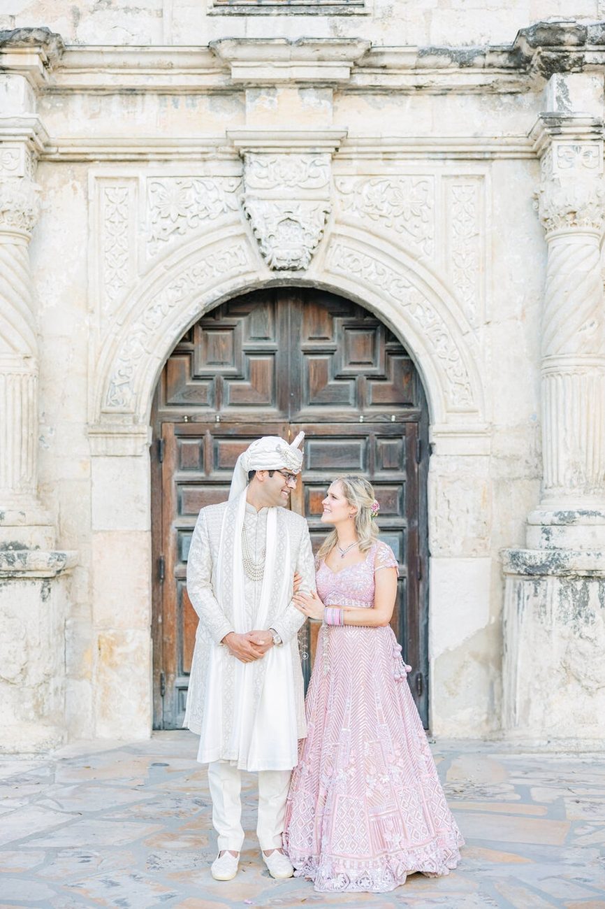 Couple in prayer during Gurdwara ceremony
