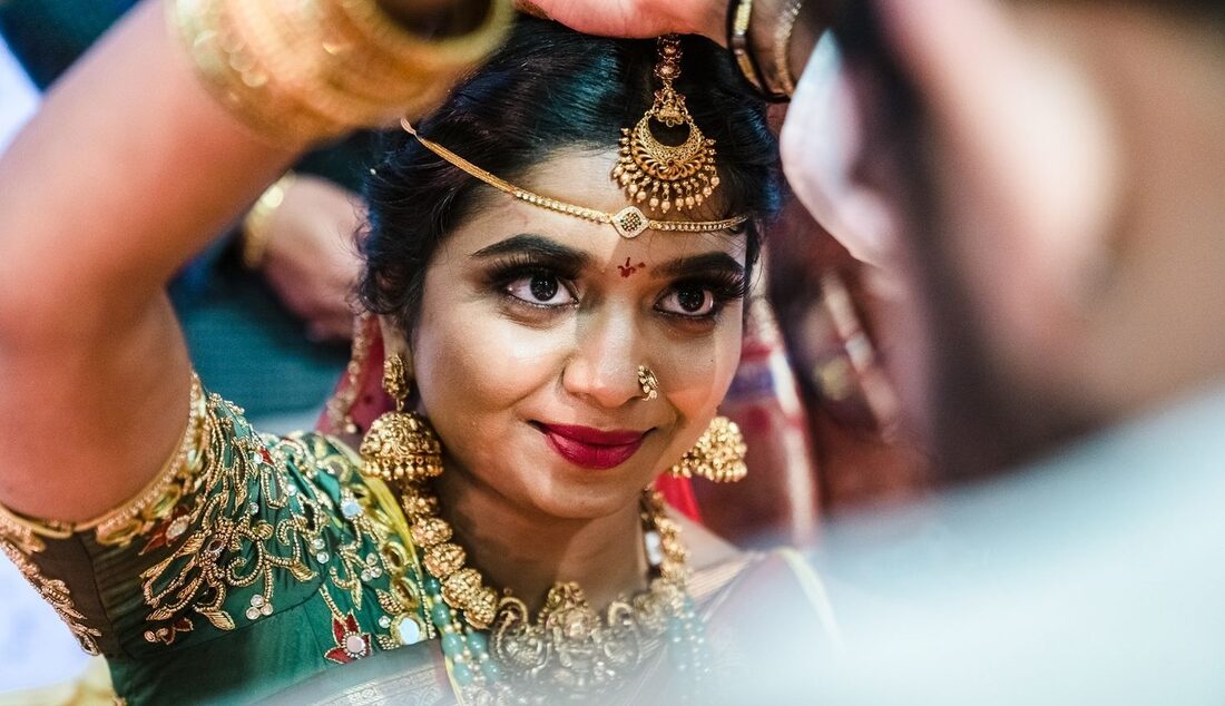 Close-up portrait of a bride in traditional jewelry
